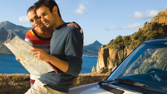 Photo of couple navigating map